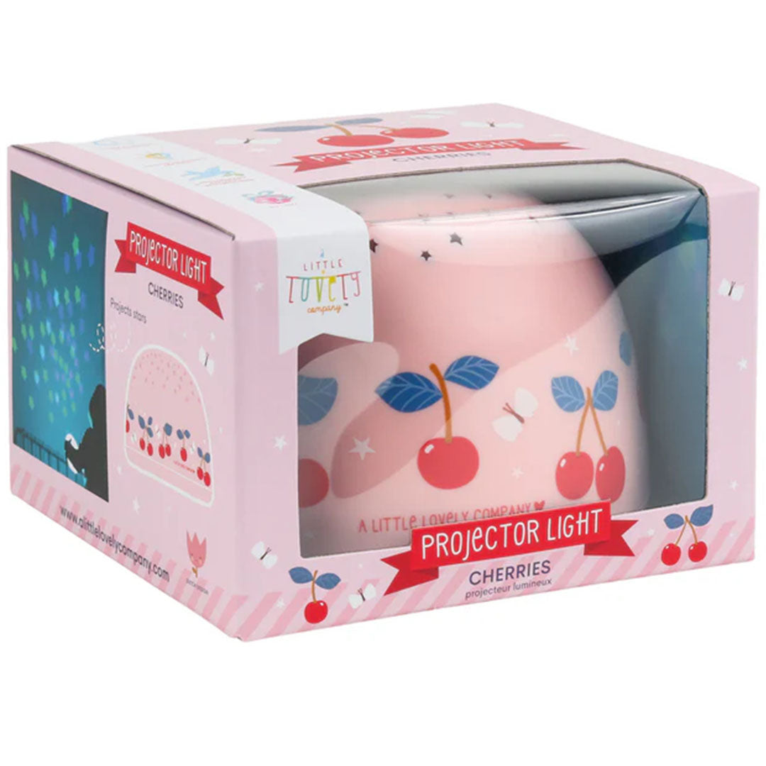 De verpakking van de A Little Lovely Company roze nachtlamp en sterprojector met kersenpatroon.