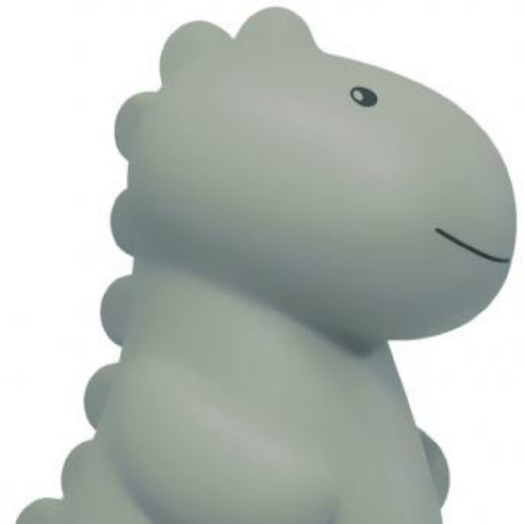 Detail van het lichtgroene dinosaurus LED nachtlampje met zicht op de kop.