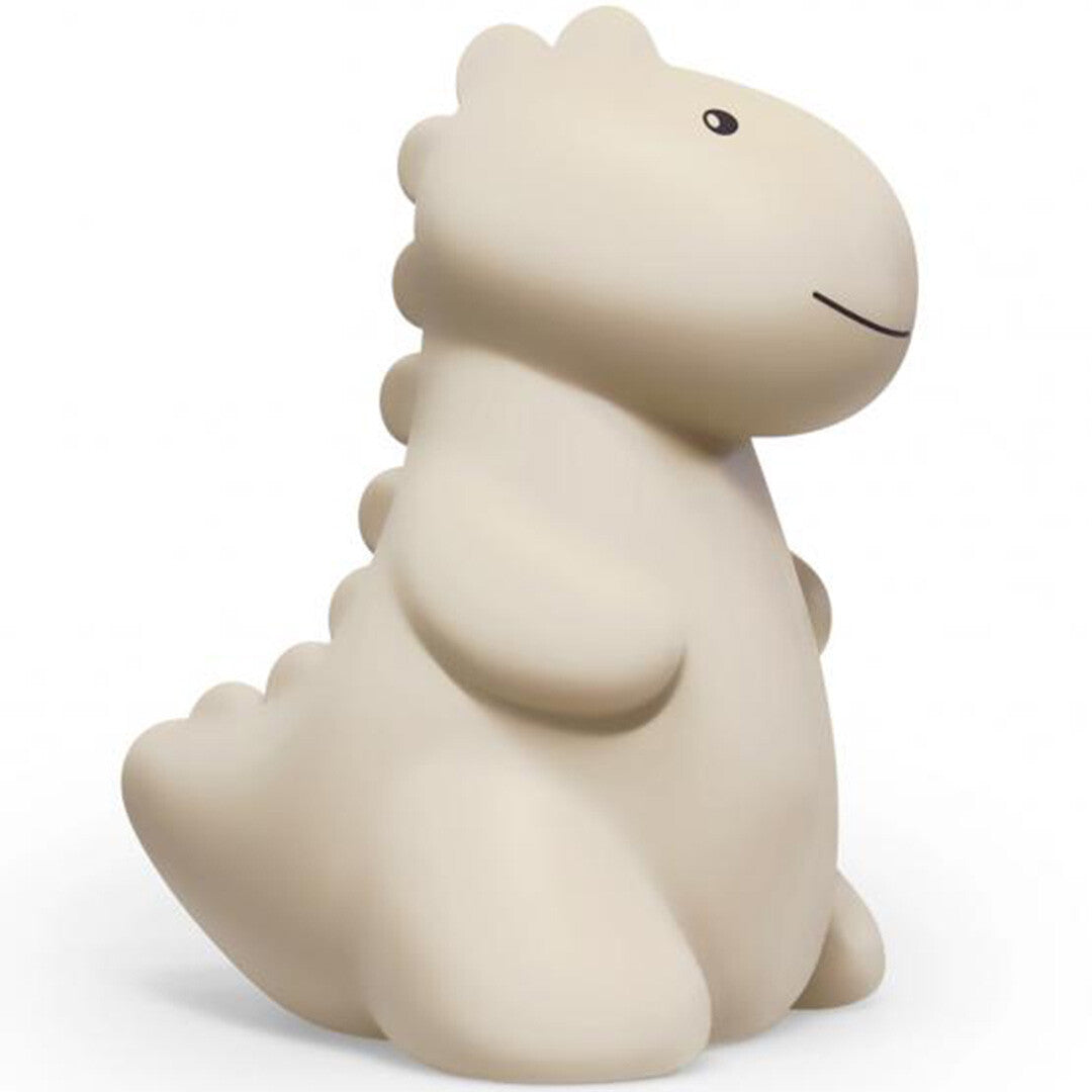 Atelier Pierre beige dino nachtlampje, geïsoleerd op een witte achtergrond.