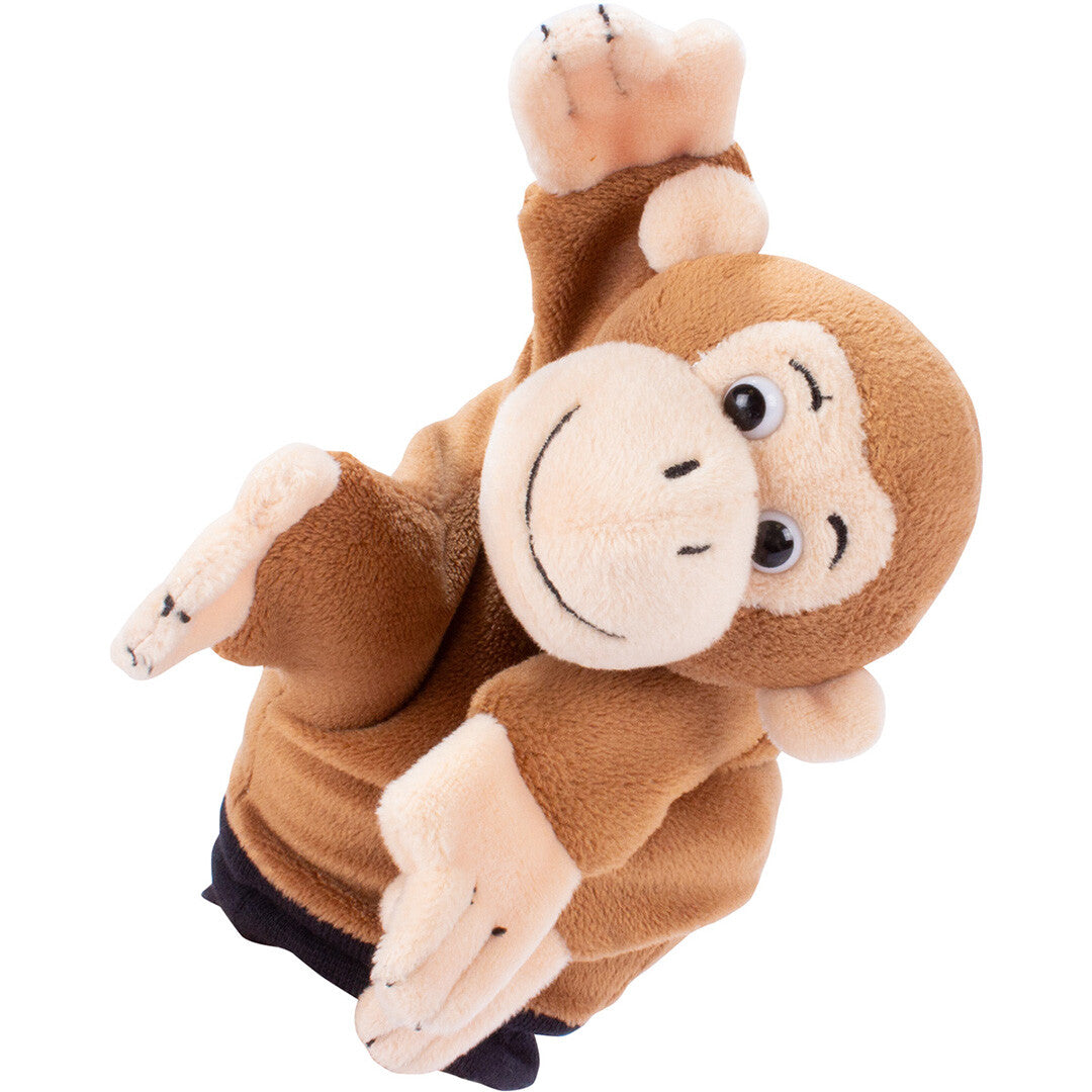 Beleduc pluchen handpop in de vorm van een bruine aap, schuin gefotografeerd.