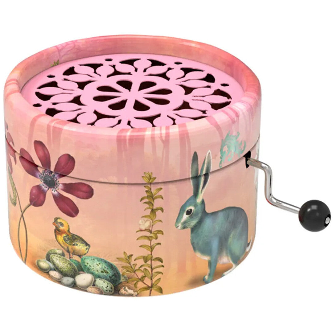 Belle Lurette rond roze muziekdoosje met een illustratie van een konijn, kuiken en bloemen.