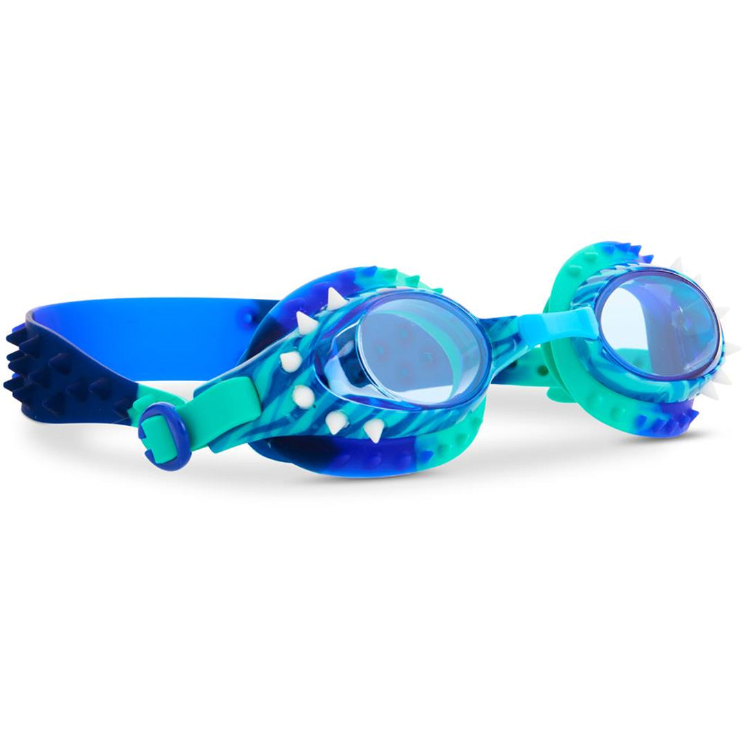 Bling2o kinderzwembril met blauw-groen dinothema en witte stekels, schuin gefotografeerd.