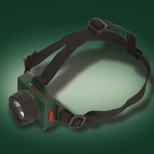 Bosch groene plastic speelgoed hoofdlamp met zwarte verstelbare band op een donkergroene achtergrond.