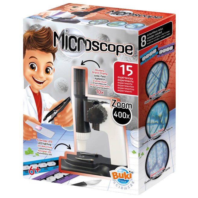 De verpakking van de Buki microscoop voor kinderen, met een afbeelding van een jongen en de microscoop.
