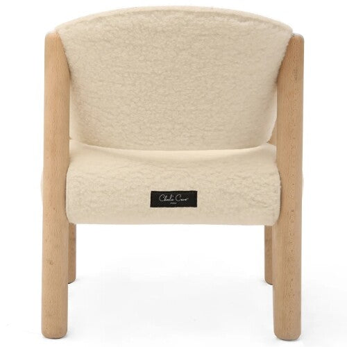 Charlie Crane kinderstoel Saba Fur, van achteren gezien, met beige wollen bekleding en een merklabel.