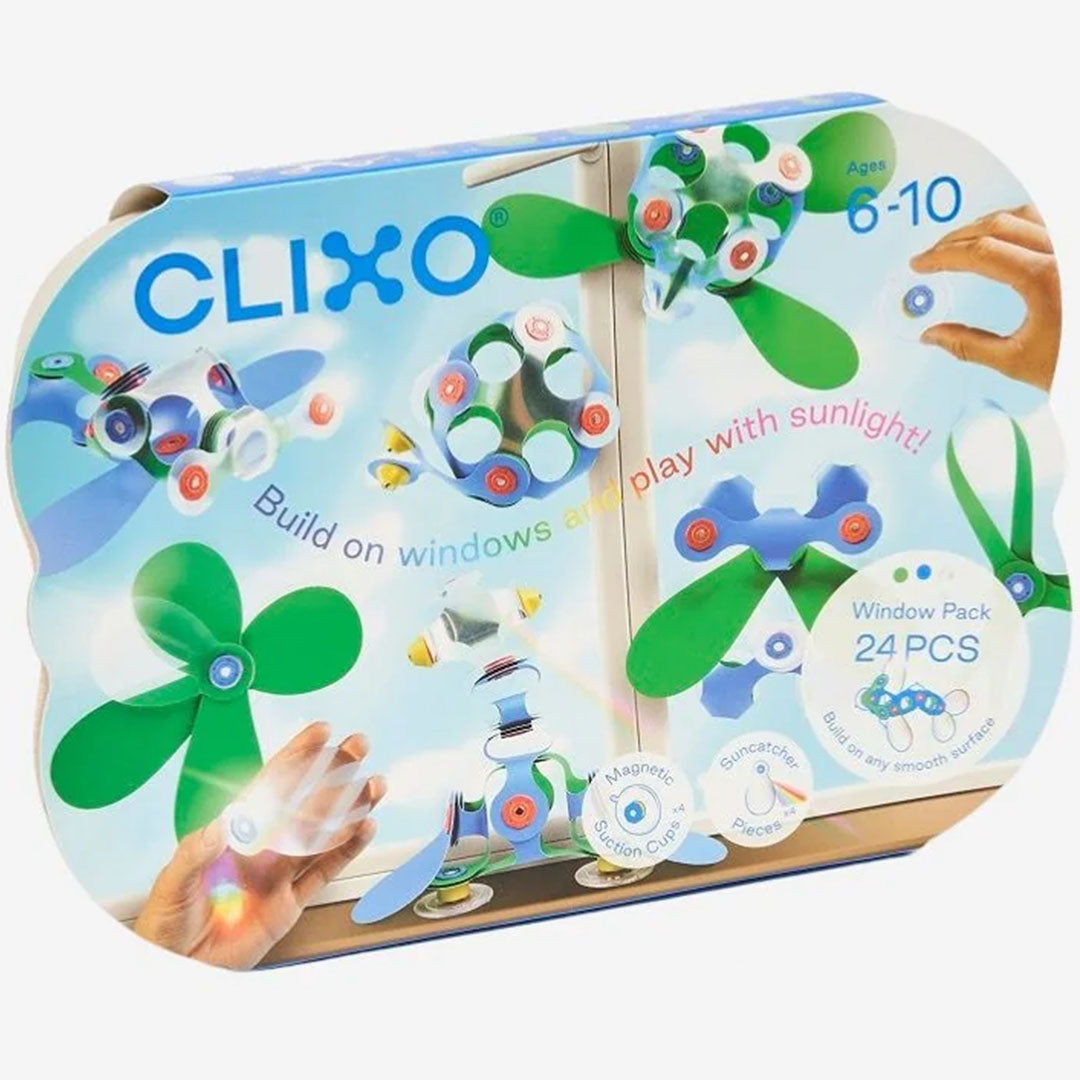 De Clixo verpakking van de magnetische bouwset voor op het raam, met voorbeelden van creaties.