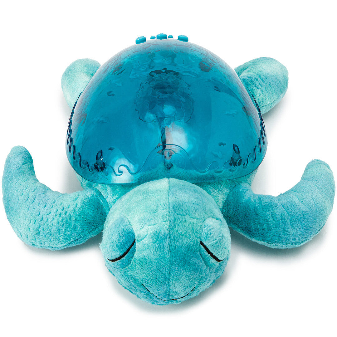 Bovenafzicht van de cloud.b knuffelschildpad met nachtlamp, met de blauwe projectieschelp duidelijk zichtbaar.