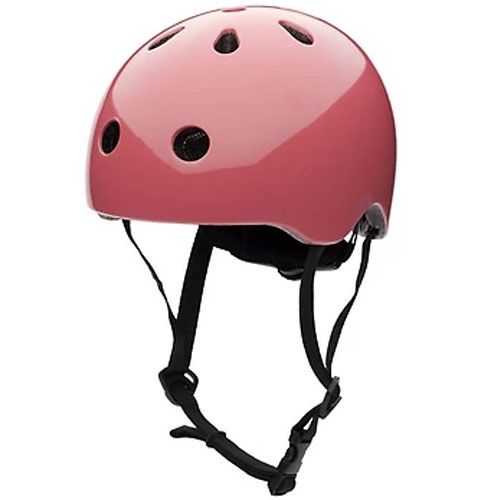 Coconuts Helmets roze kinderfietshelm, schuin van voren gefotografeerd.