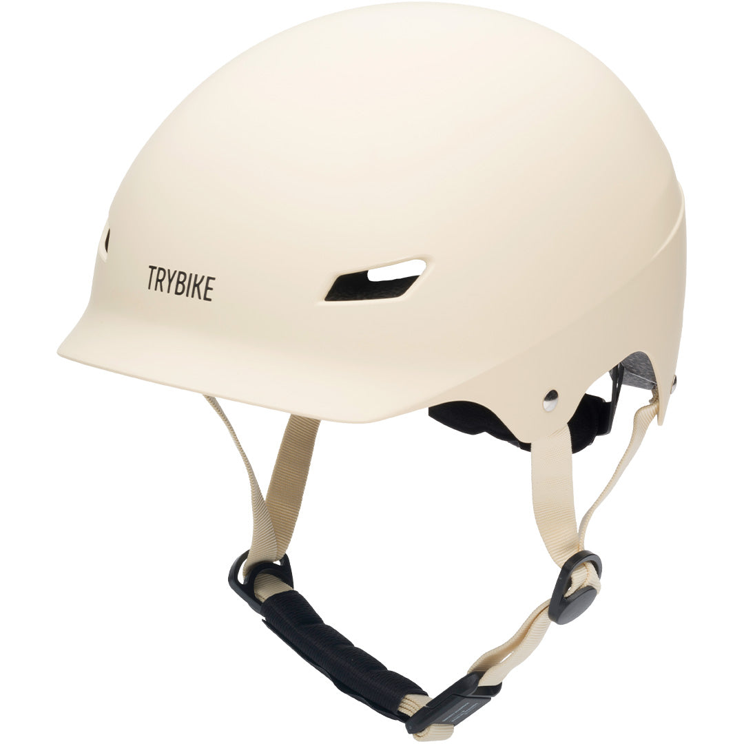 Coconuts Helmets kinderhelm in vintage crème kleur met het Trybike logo erop.