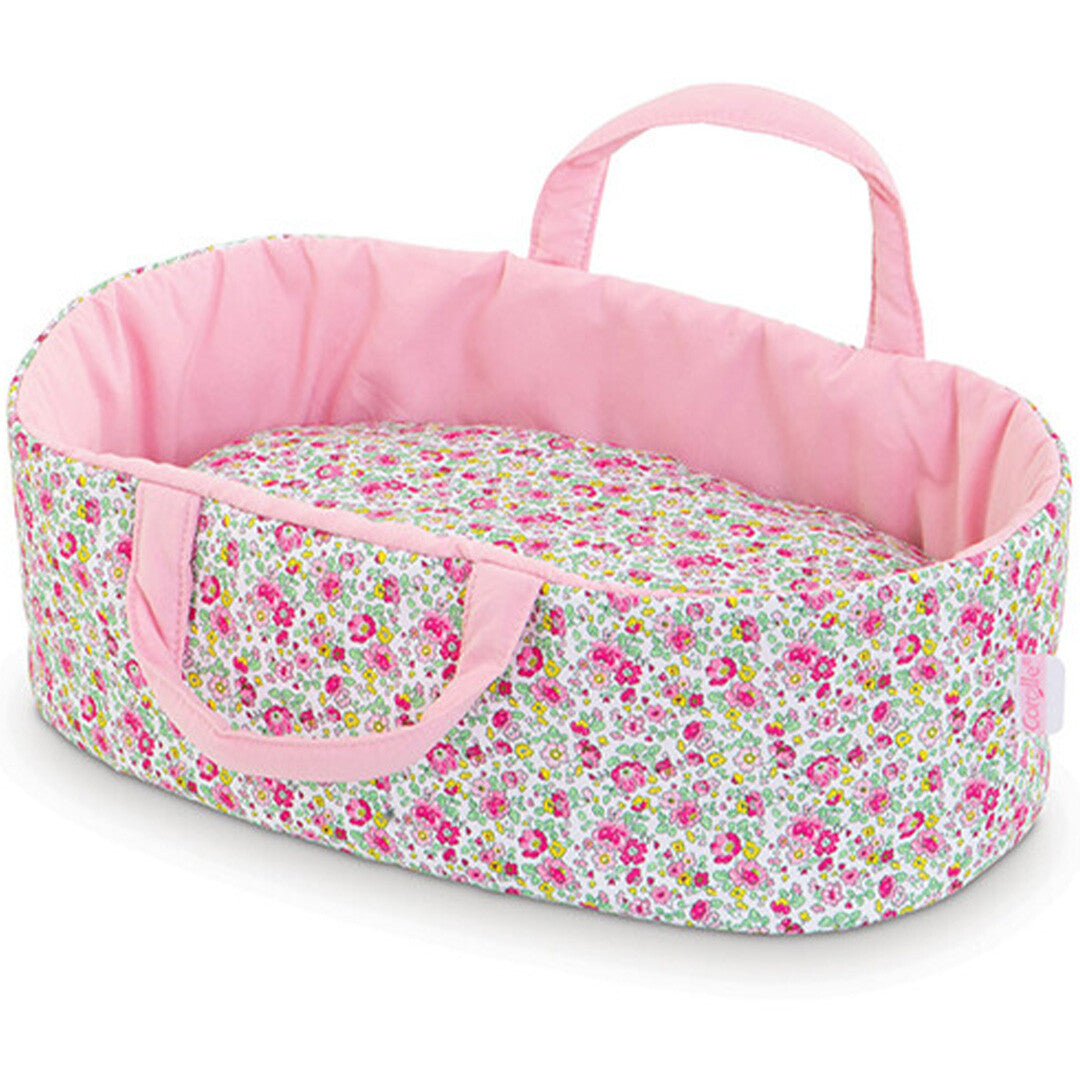 Corolle poppenreiswieg met roze bloemenpatroon en roze handvatten.