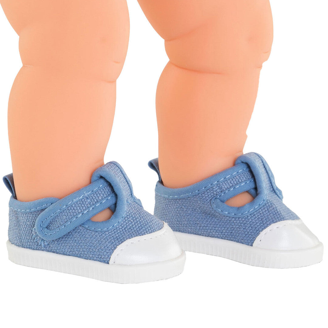 Corolle blauwe poppenschoenen aan de voeten van een pop.