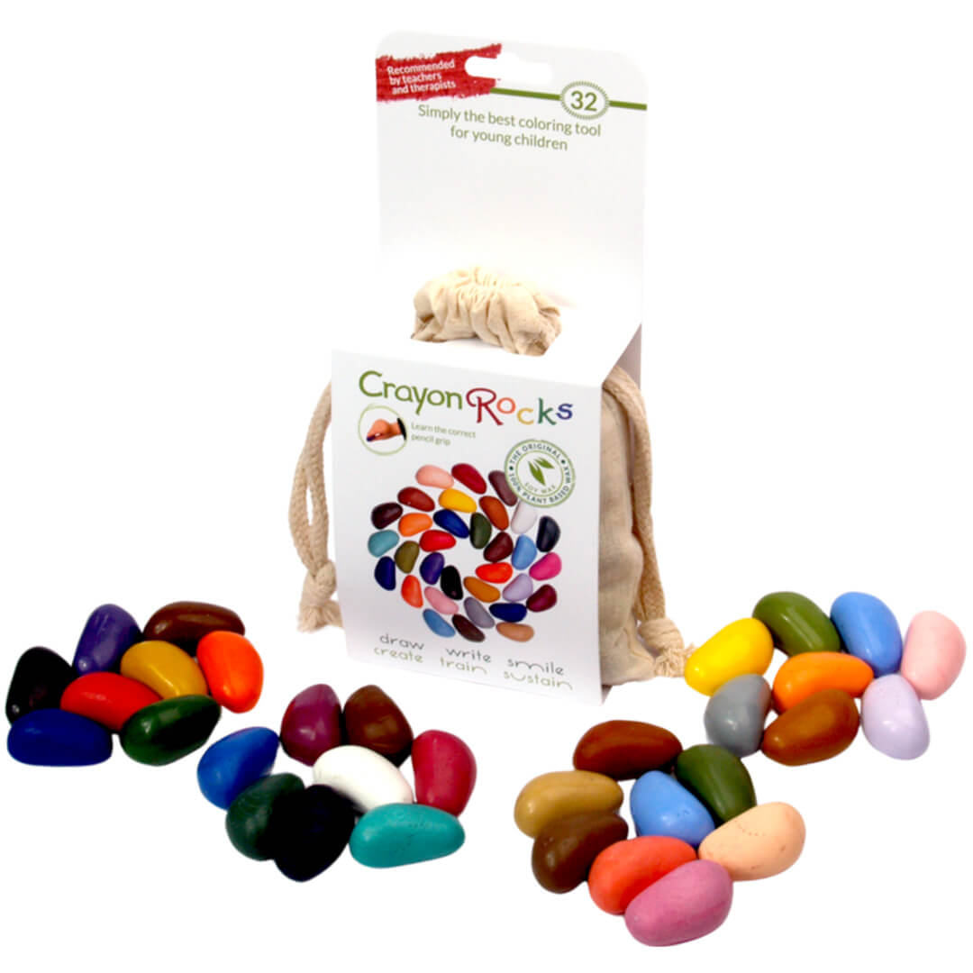 De Crayon Rocks verpakking met drie hoopjes waskrijtjes in diverse kleuren ernaast.