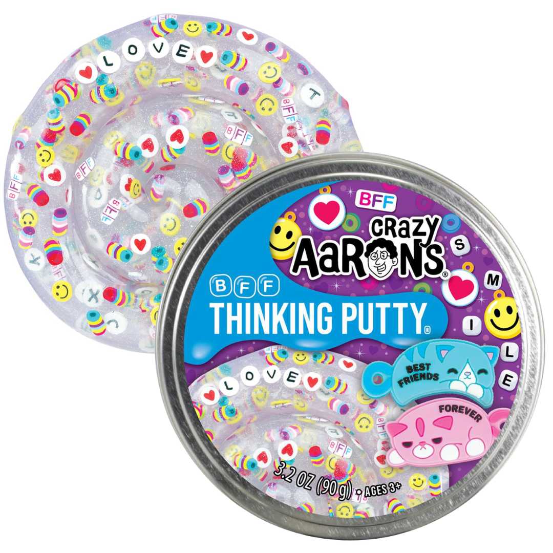 Crazy Aaron's BFF Thinking Putty, een blikje met deels zichtbare transparante putty vol kleurrijke harten, smileys en tekst.