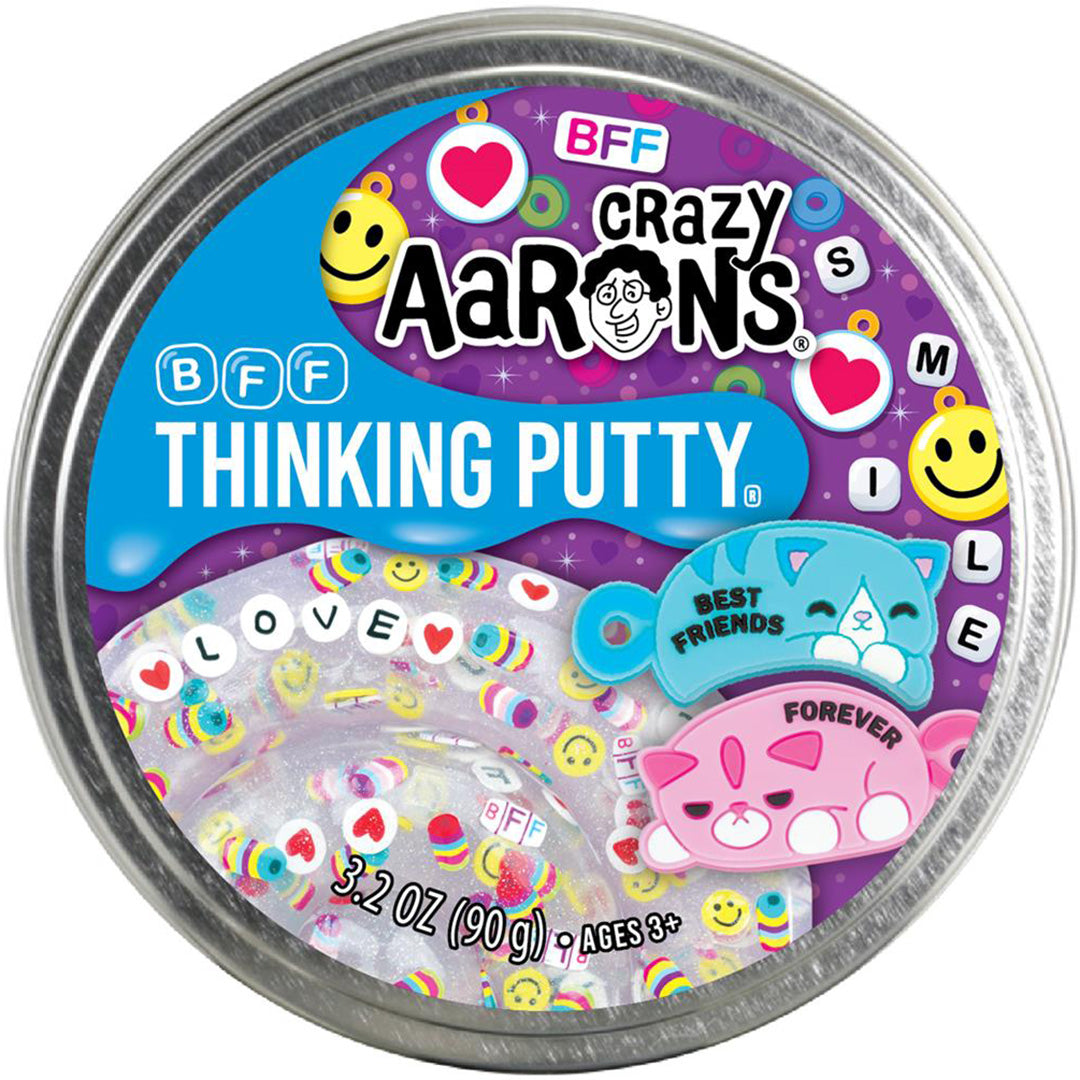 Bovenopzicht van een gesloten blikje Crazy Aaron's BFF Thinking Putty met een deksel met katten, harten en smileys.