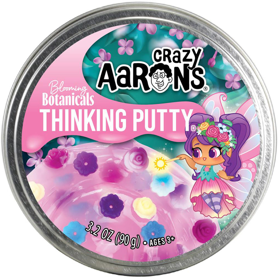 De ronde metalen verpakking van Crazy Aaron's Thinking Putty Blooming Botanicals, met een fee en bloemen.