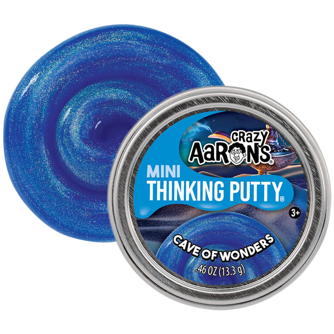 Crazy Aaron's Mini Thinking Putty 'Cave of Wonders' in blauw glitter naast de metalen verpakking.
