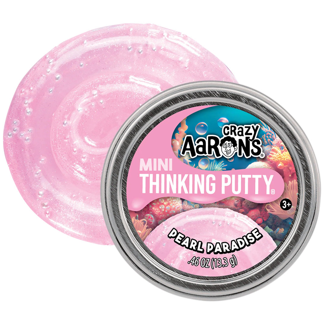 Crazy Aaron's Mini Thinking Putty Pearl Paradise blikje met de roze, glinsterende putty ernaast.