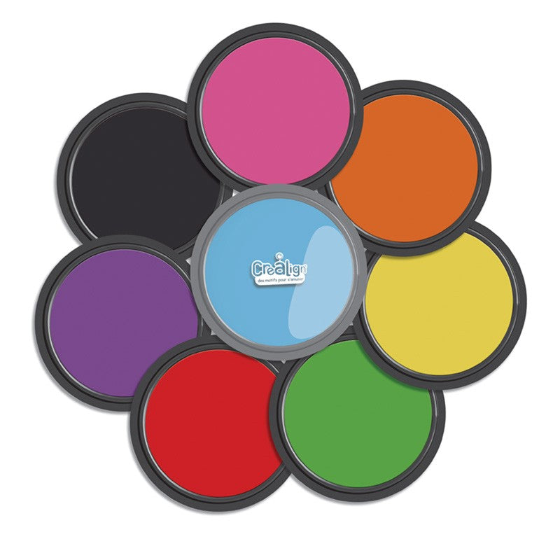 Crealign inktkussens in regenboogkleuren, in een cirkelpatroon met een blauw kussen in het midden.