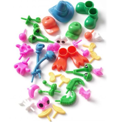Een collectie Creall plastic lichaamsdelen in diverse kleuren, zoals ogen, handen, voeten en hoeden, voor boetseerwerk.