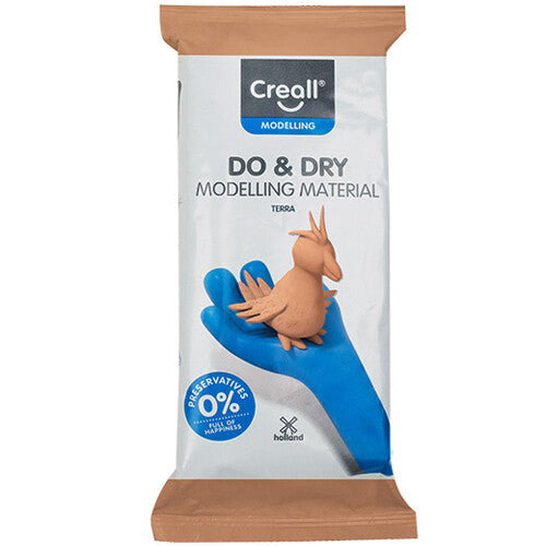 Creall luchthardende boetseerklei verpakking met een afbeelding van een klein klei vogeltje op een blauwe hand.
