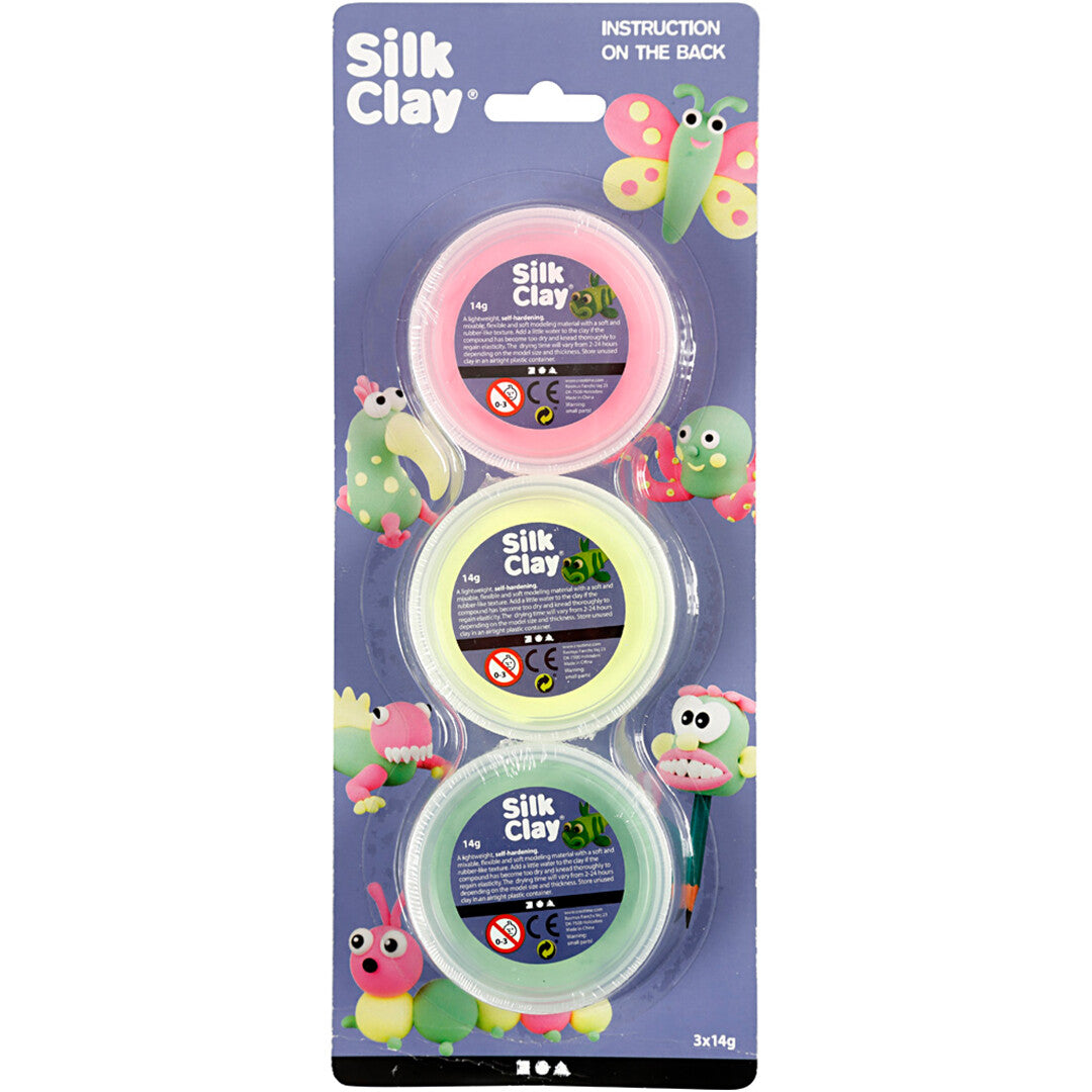 De voorkant van de verpakking van Creativ Company Silk Clay boetseerklei met drie potjes in neonkleuren.