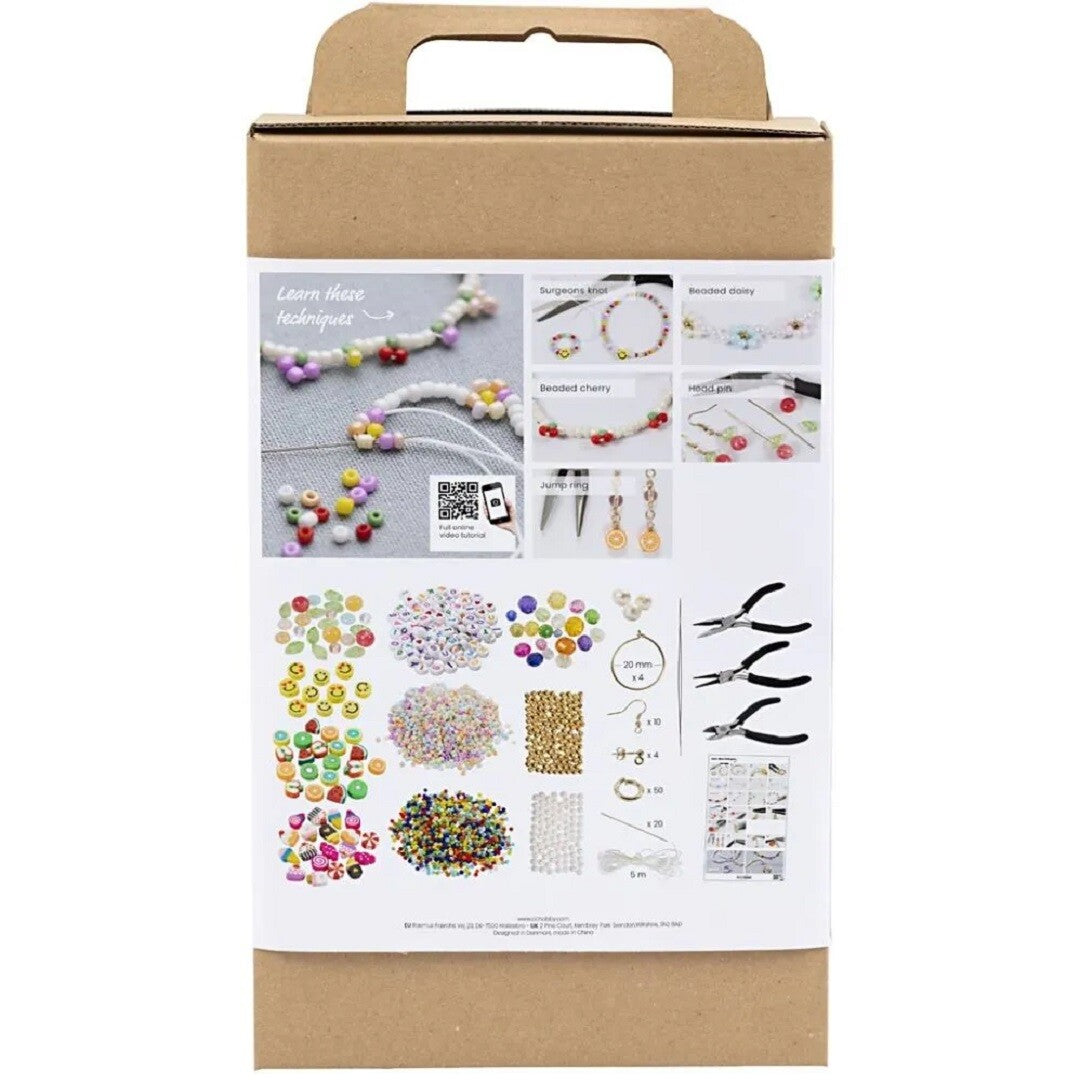 Achterkant van de creativ company knutselset sieraden verpakking met voorbeelden van technieken en een overzicht van de inhoud.