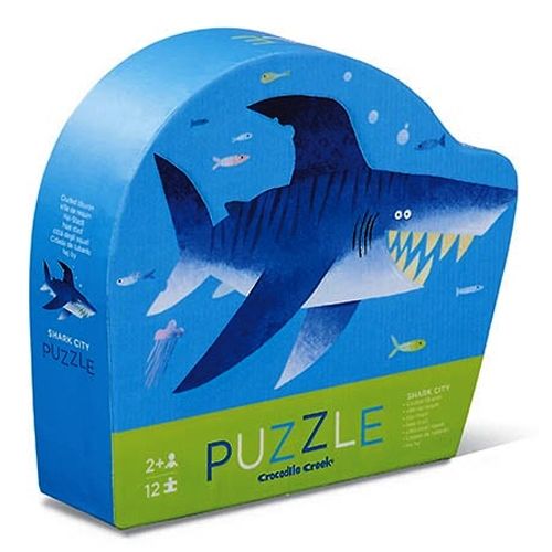 Crocodile Creek haaienpuzzel verpakking met een grote blauwe haai en kleine vissen, geschikt voor 2 jaar en ouder.