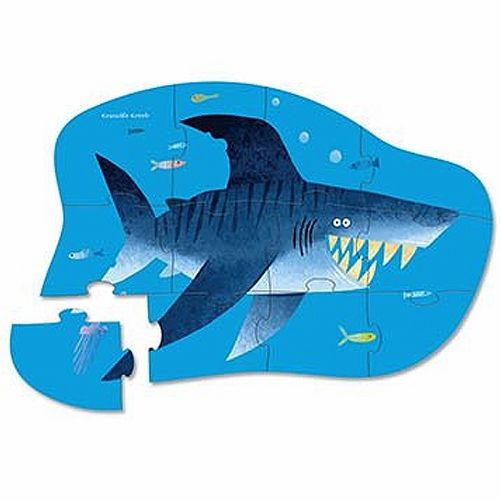 Crocodile Creek contourpuzzel van een grote blauwe haai met vissen en een kwal in het water, met één los stuk.