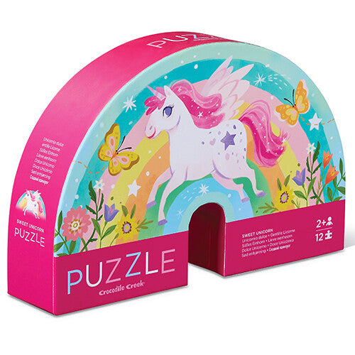 Crocodile Creek eenhoorn puzzelverpakking in de vorm van een regenboog met een vliegende eenhoorn.