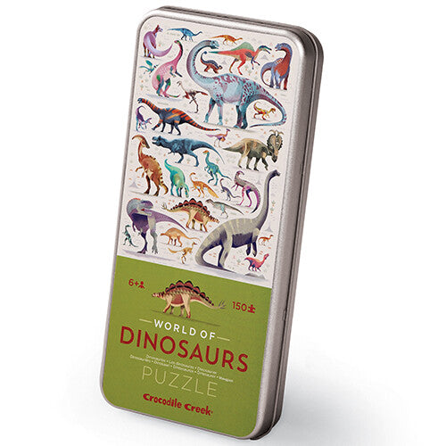 Crocodile Creek puzzel in blik met een illustratie van diverse dinosaurussen.