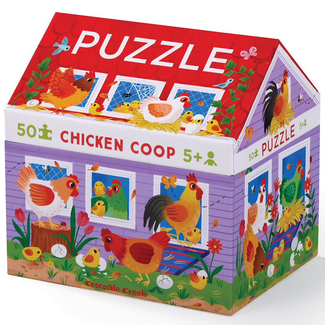 Crocodile Creek puzzelverpakking in de vorm van een kippenhok met illustraties van kippen en kuikens.