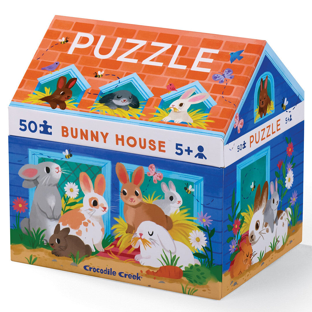 Crocodile Creek puzzelverpakking in de vorm van een konijnenhuis met illustraties van konijnen.