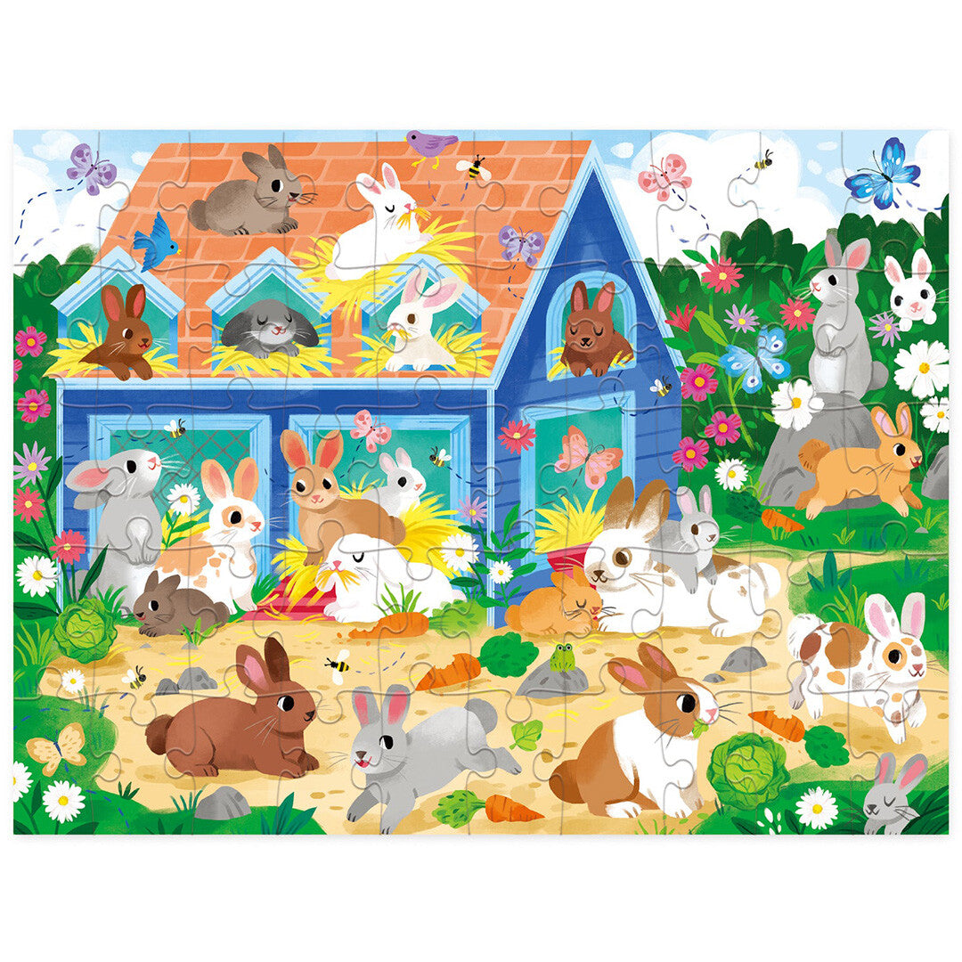 Crocodile Creek legpuzzel met een afbeelding van een konijnenhuis en veel konijnen in een tuin.