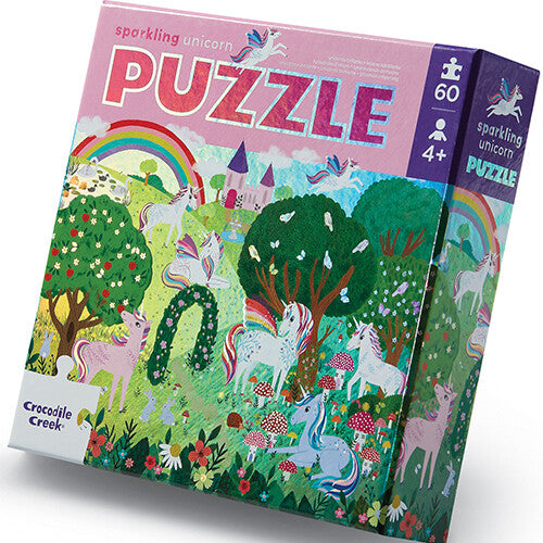 Crocodile Creek legpuzzel verpakking met eenhoorns en een regenboog.