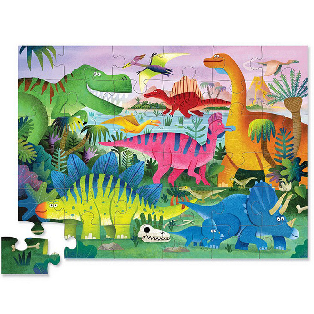 Voltooide Crocodile Creek legpuzzel met kleurrijke dinosaurussen in een jungle.