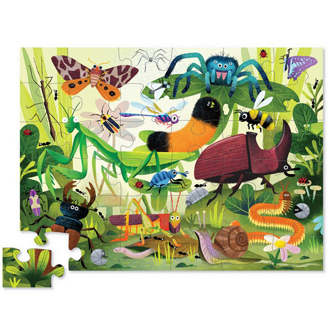 Crocodile Creek vloerpuzzel insecten, compleet gelegd, met een kleurrijke illustratie van diverse insecten en bladeren.