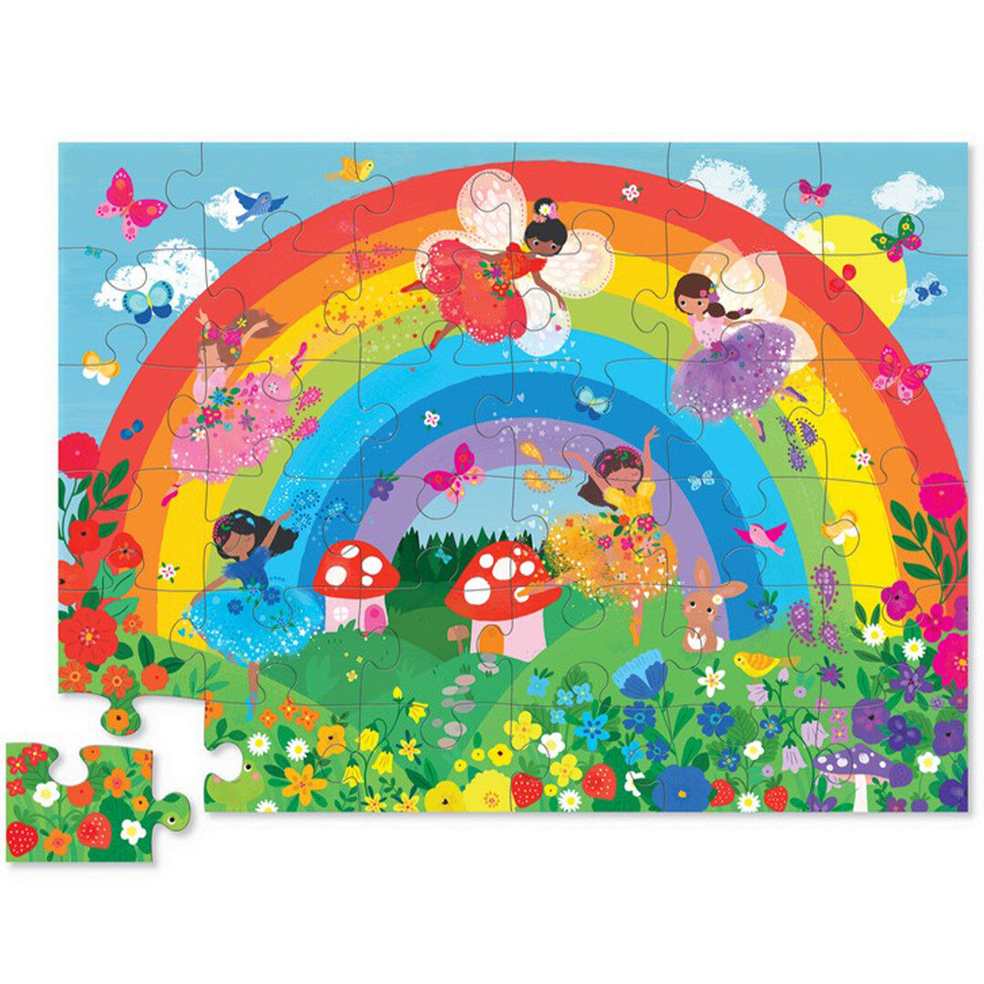 De complete Crocodile Creek vloerpuzzel met een regenboog, feeën, bloemen en dieren, met één los puzzelstuk.
