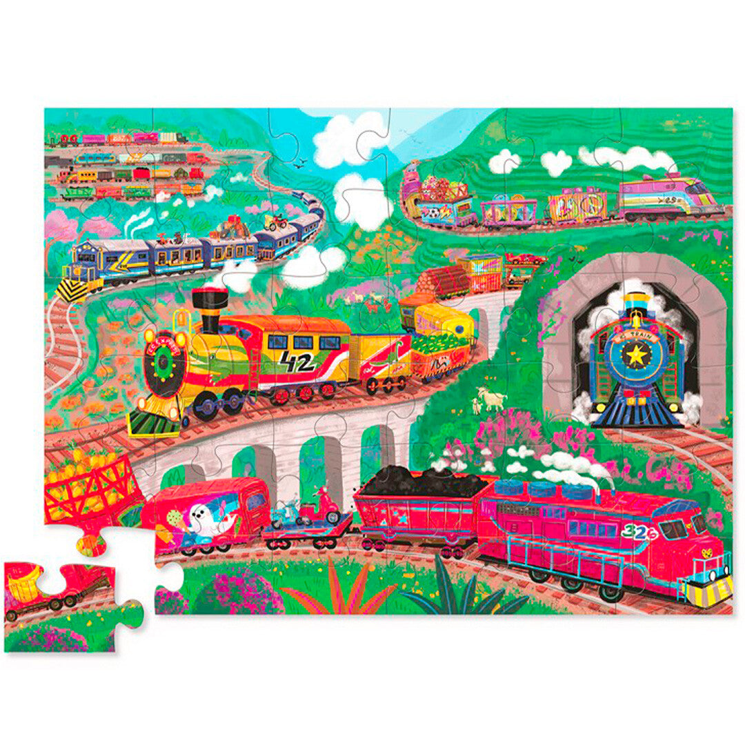 Voltooide vloerpuzzel met een kleurrijk landschap vol treinen, bruggen en tunnels.