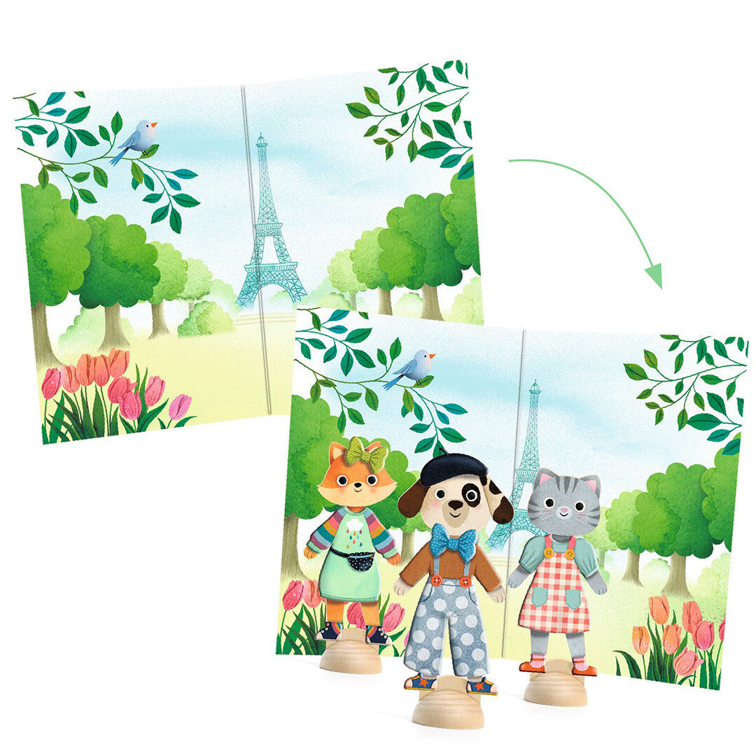 Drie Djeco aankleedpoppen van dieren voor een Parijse parkachtergrond met de Eiffeltoren.