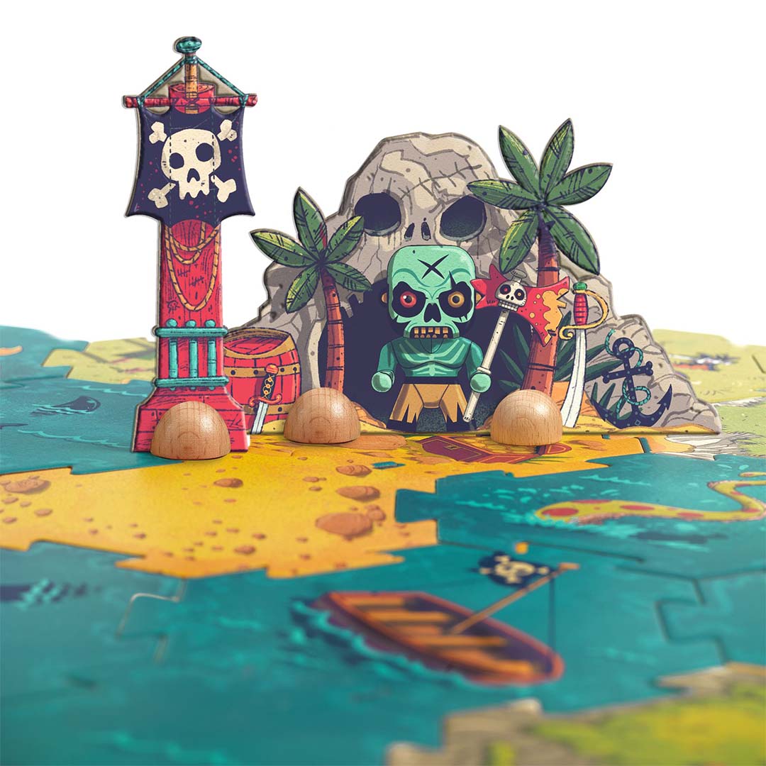 Detailopname van het pirateneiland met een schedelgrot en een piratenfiguur, geplaatst op de Djeco Arty Toys reuze puzzel.