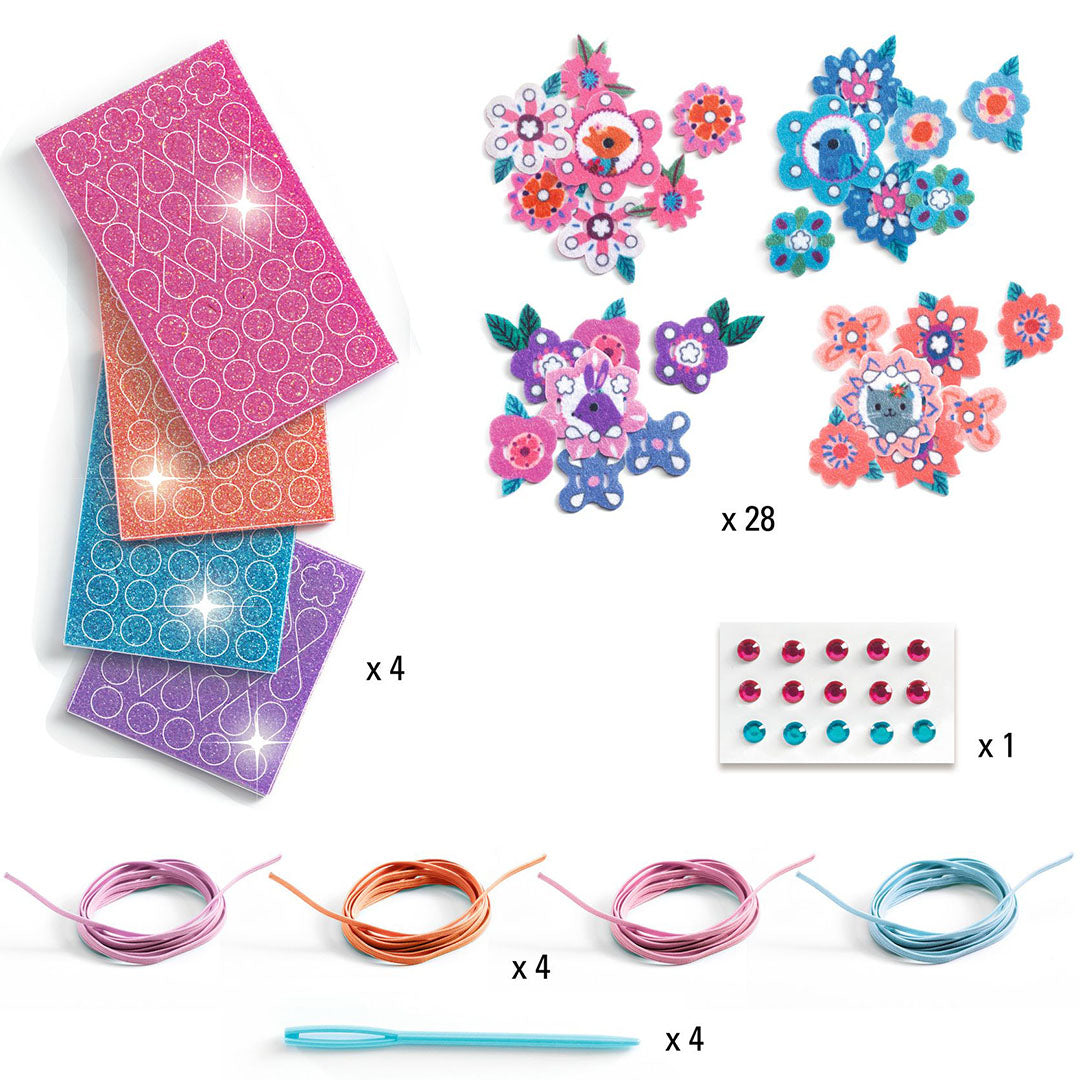 Alle onderdelen van de Djeco knutselset voor vilten armbandjes, inclusief vilt, draad en stickers.