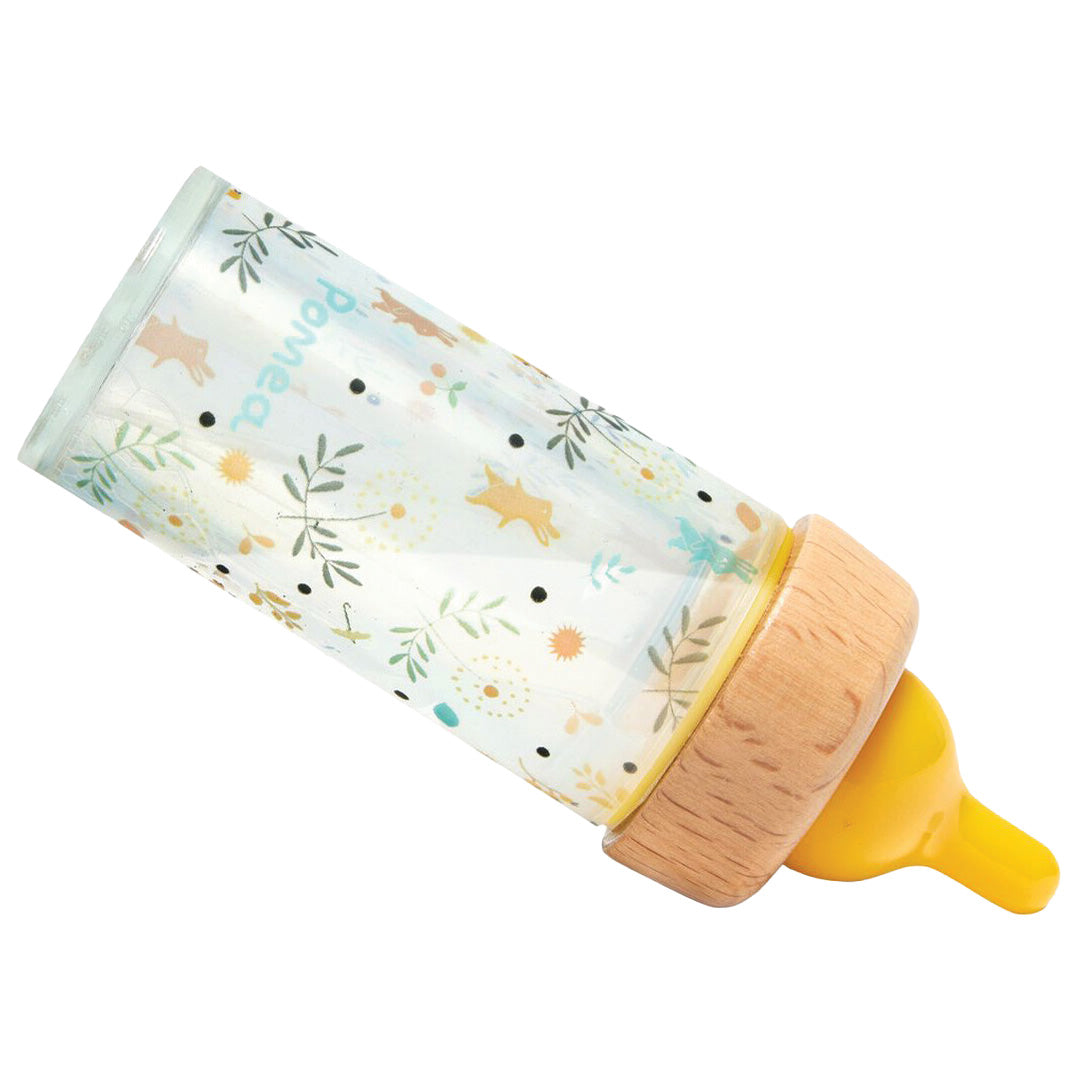 Djeco magische poppenfles met konijntjes- en bloemenpatroon, schuin liggend.