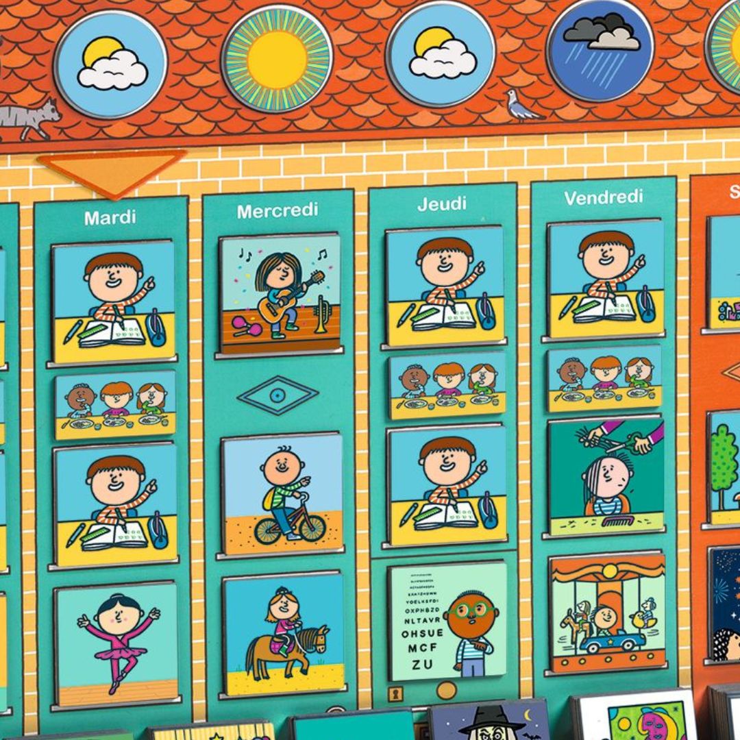 Detail van de Djeco magneetbord weekplanner met de dagen dinsdag tot en met vrijdag en diverse activiteitenmagneten.