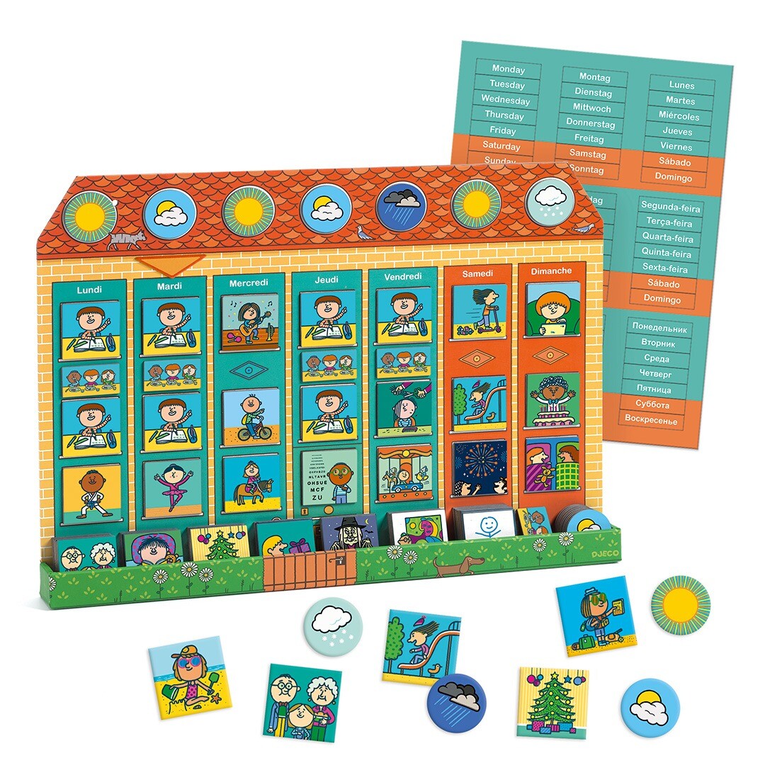 De Djeco magneetbord weekplanner met huisvormig bord, losse magneten en een lijst met dagen in meerdere talen.