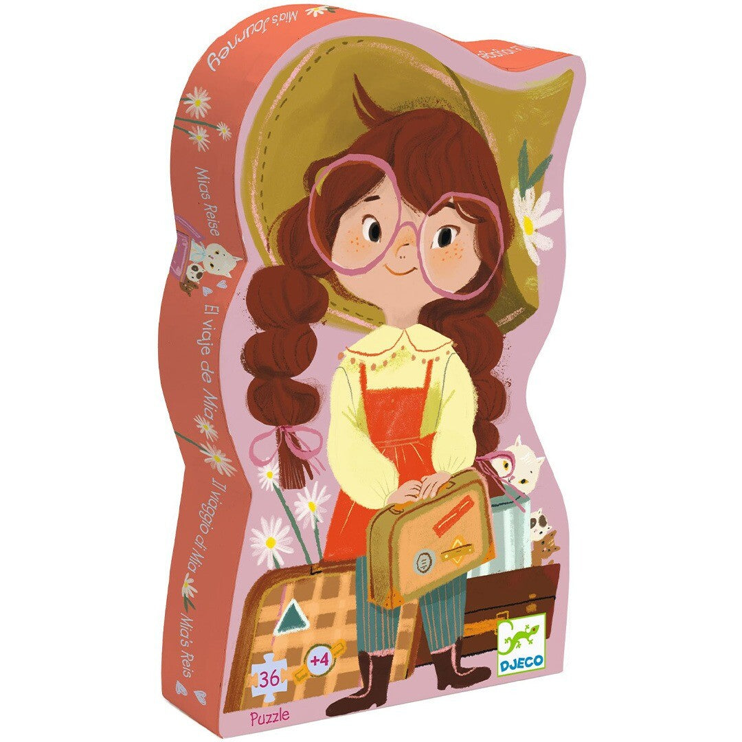 Djeco puzzelverpakking in de vorm van een meisje met koffer, voor de Mia's Journey kinderpuzzel.