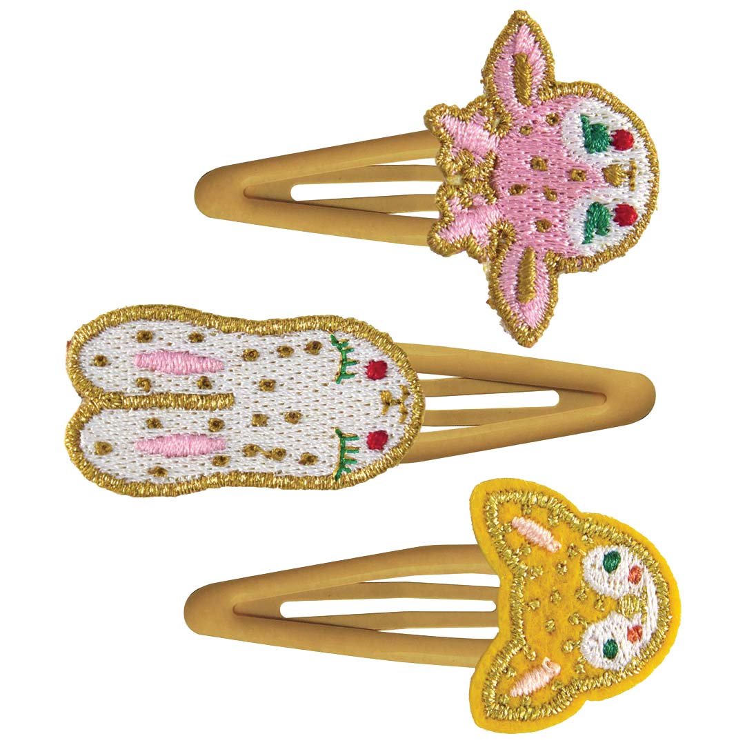 Djeco haarspeldjes met drie geborduurde konijnenfiguren in roze, wit en geel.