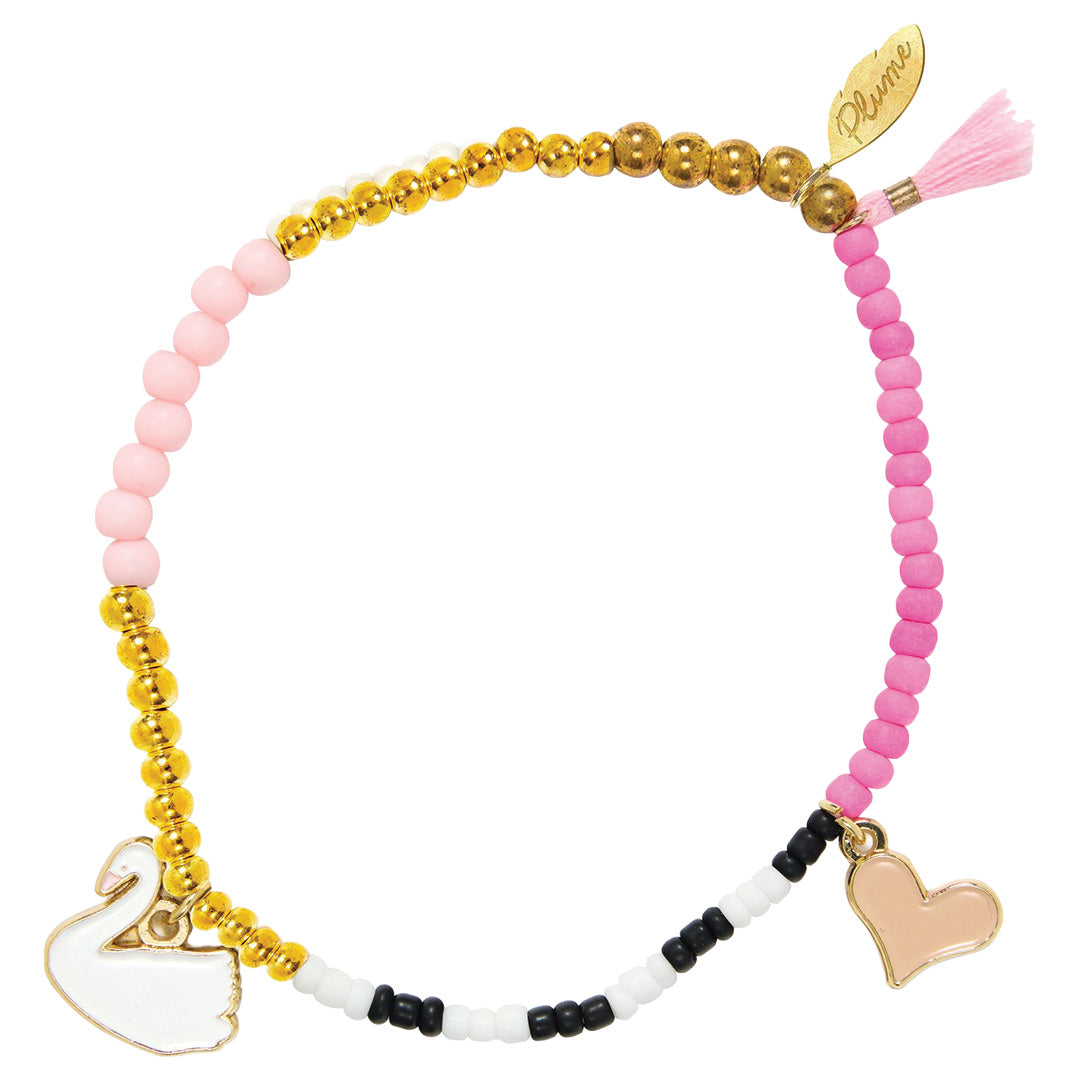 Djeco kinderarmband met roze, gouden, zwarte en witte kralen, een zwaanbedeltje en een hartje.