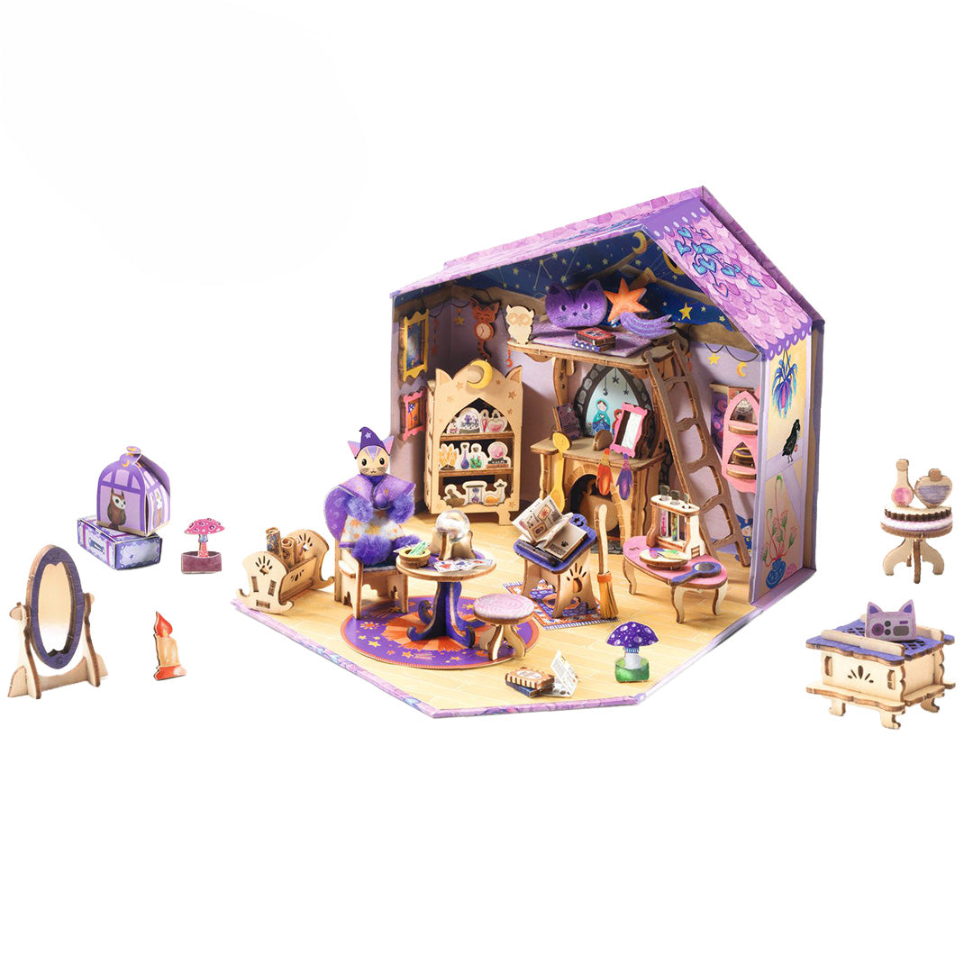 Djeco houten knutselset van een paars poppenhuis met een kattenfiguur en miniatuurmeubels.