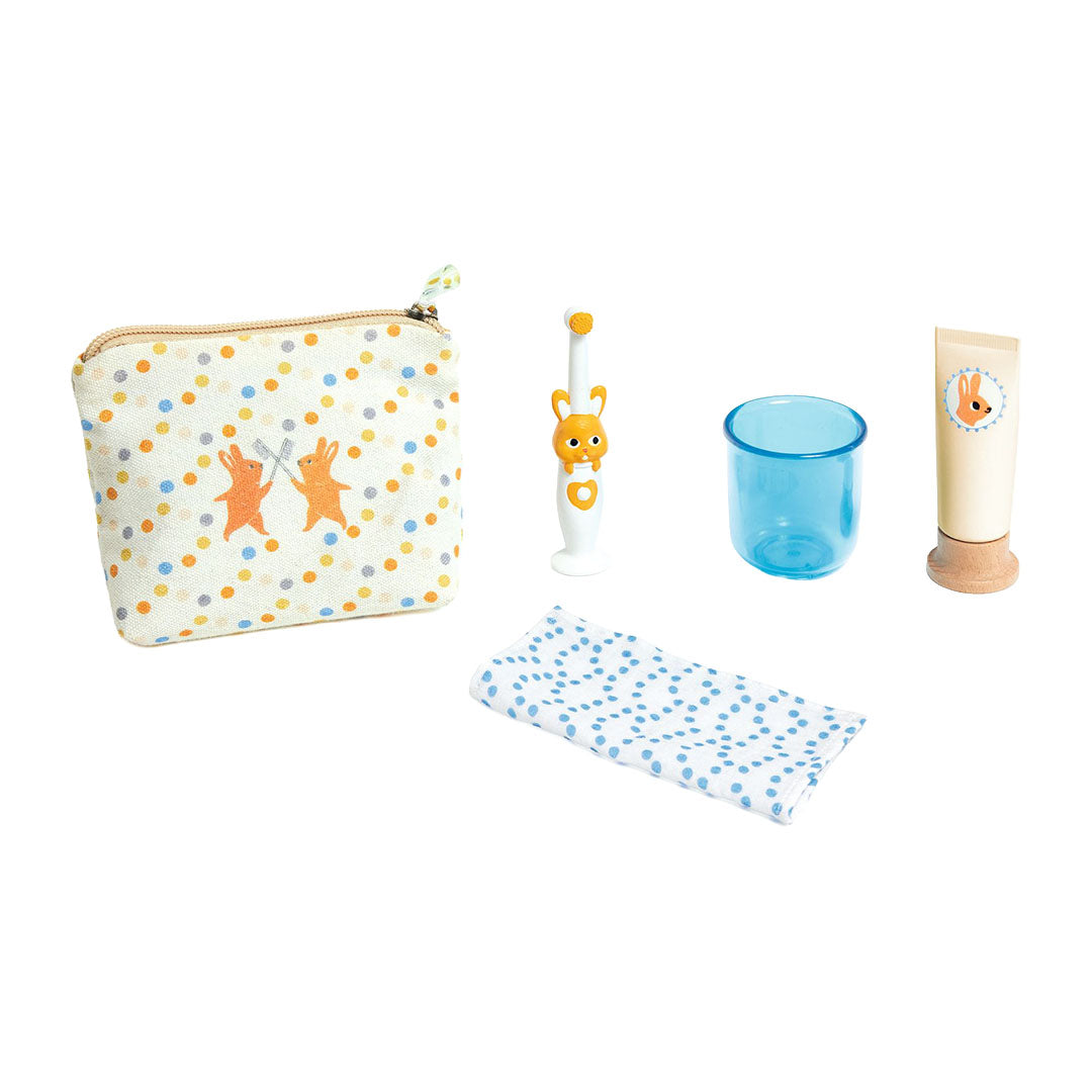 De Djeco Pomea poppentandenborstel set met etui met konijnen, tandenborstel, beker, handdoek en tandpasta.