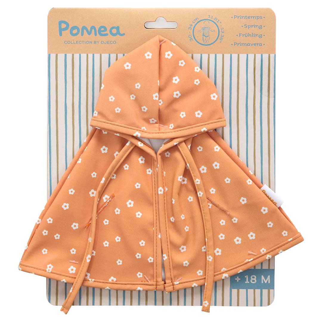 Djeco Pomea oranje gebloemde poppenregencape op de verpakking.